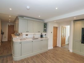 A kitchen with cabinetry and countertops at Brettargh Holt Mansion 32 near Levens