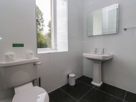 A bathroom with a toilet and sink at Brettargh Holt Mansion 32 near Levens