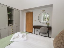 A bedroom with a bed and a desk at Brettargh Holt Mansion 32 near Levens
