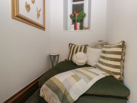A snug area with a sofa and cushions at Brettargh Holt Mansion 32 near Levens