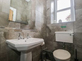 A bathroom with a sink and toilet at Brettargh Holt Mansion 32 near Levens