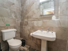 A bathroom with a toilet and sink at Brettargh Holt Mansion 32 near Levens