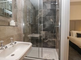 A bathroom with sink and shower at Brettargh Holt Mansion 32 near Levens