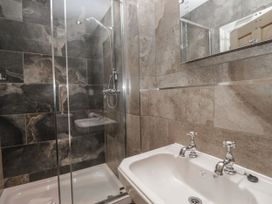 A bathroom with a shower and sink at Brettargh Holt Mansion 32 near Levens