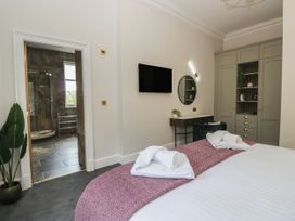 A bedroom with a bed and towels at Brettargh Holt Mansion 32 near Levens