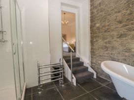 A bathroom with a shower enclosure and bathtub at Brettargh Holt Mansion 32 near Levens