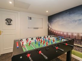 A game room featuring a foosball table at Brettargh Holt Mansion 32 near Levens