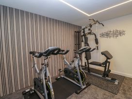 A gym with exercise equipment at Brettargh Holt Mansion 32 near Levens