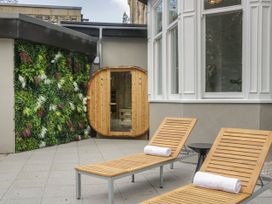 An outdoor area with sun loungers and a sauna at Brettargh Holt Mansion 32 near Levens
