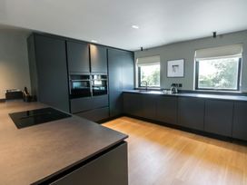 A kitchen with an oven and sink at Brynseion Uchaf near Aberystwyth