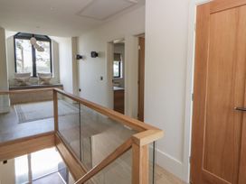 A hallway with a window seat and doors at Brynseion Uchaf near Aberystwyth