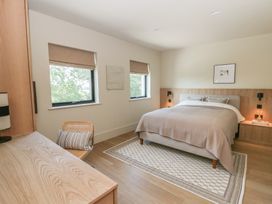 A bedroom with a bed and desk at Brynseion Uchaf near Aberystwyth