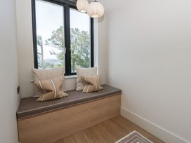 A snug with a window seat and cushions at Brynseion Uchaf near Aberystwyth