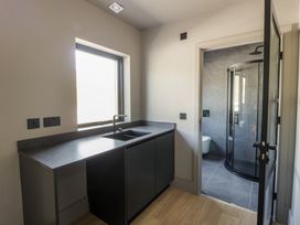 A bathroom with a sink and shower at Brynseion Uchaf near Aberystwyth