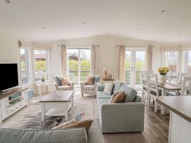 A living room with a coffee table and sofa at Hazelwood 3 in Pinewood Retreat in Rousdon near Lyme Regis