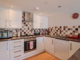 A kitchen with appliances and utensils at Beck House in Weymouth