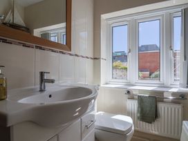 A bathroom with a sink and a toilet at Beck House in Weymouth