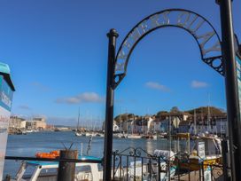 A view of brewers quay with boats and buildings in Weymouth