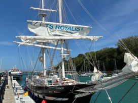 A sailing ship named TS Royalist at a dock in Weymouth