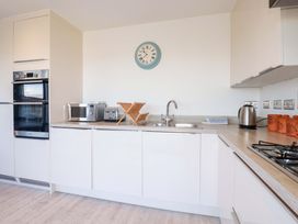A kitchen with appliances and a sink at Serfaus in Perranporth