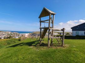 A play structure with climbing frame and slide at Serfaus in Perranporth