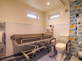 A bathroom with a shower and bed shower at Freedom Lodge @ Summerfield Farm, Whitby
