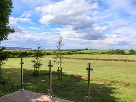 An outdoor view with grass and trees at Freedom Lodge @ Summerfield Farm in Whitby