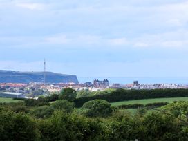 A view of buildings and coastline at Freedom Lodge @ Summerfield Farm Whitby