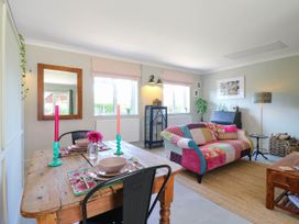 A living room with a table and chairs at The Annexe @ Shotley Cottage Shotley Gate