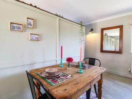 A dining room with a table set for two at The Annexe @ Shotley Cottage in Shotley Gate