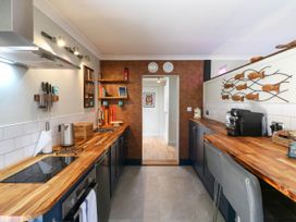 A kitchen featuring a cooking stove and kitchen sink at The Annexe @ Shotley Cottage Shotley Gate