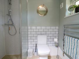 A bathroom with a shower and toilet at The Annexe @ Shotley Cottage in Shotley Gate