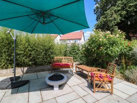A garden with seating and a fire pit at The Annexe @ Shotley Cottage, Shotley Gate
