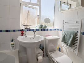 A bathroom with a sink and toilet at Tane in Winterborne Stickland