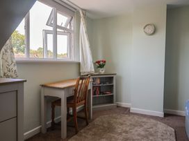 A bedroom with a desk and bookshelf at Tane in Winterborne Stickland