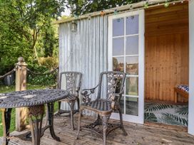 An outdoor area with a table and chairs at Tane in Winterborne Stickland