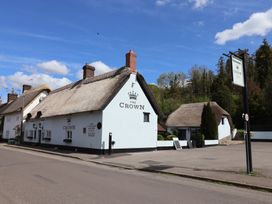 A thatched roof pub called The Crown at The Crown in Winterborne Stickland