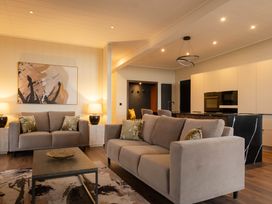 A living room with a sofa and coffee table at Exclusive Tempest Spa in Grimsby