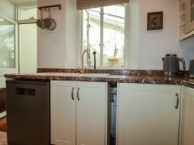 A kitchen with a sink and dishwasher at 18 Tregea Terrace in Portreath
