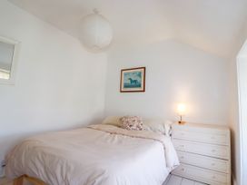 A bedroom with a bed and a dresser at 18 Tregea Terrace in Portreath