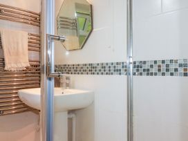 A bathroom with a shower and sink at 18 Tregea Terrace in Portreath