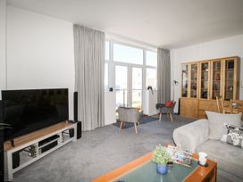 A living room with a television and a coffee table at Portland View in Portland Bill