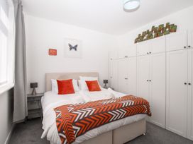 A bedroom with bed and wardrobe at Portland View in Portland Bill