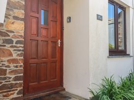 A front door and window at Stowaway Cottage in Padstow