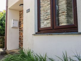 A property entrance with a mailbox and window at Stowaway Cottage in Padstow