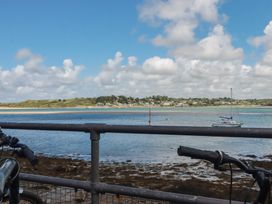 A view of water with boats and land at Stowaway Cottage in Padstow