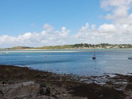 A view of boats on water and shoreline at Stowaway Cottage in Padstow
