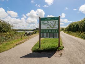 A sign for the Camel Trail with bicycles on the side path at Stowaway Cottage Padstow