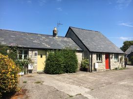 Two stone cottages with yellow and red doors at Swallow Cottage near Cowbridge
