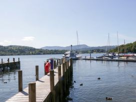 A dock with boats on water at 51 Calgarth Park in Troutbeck